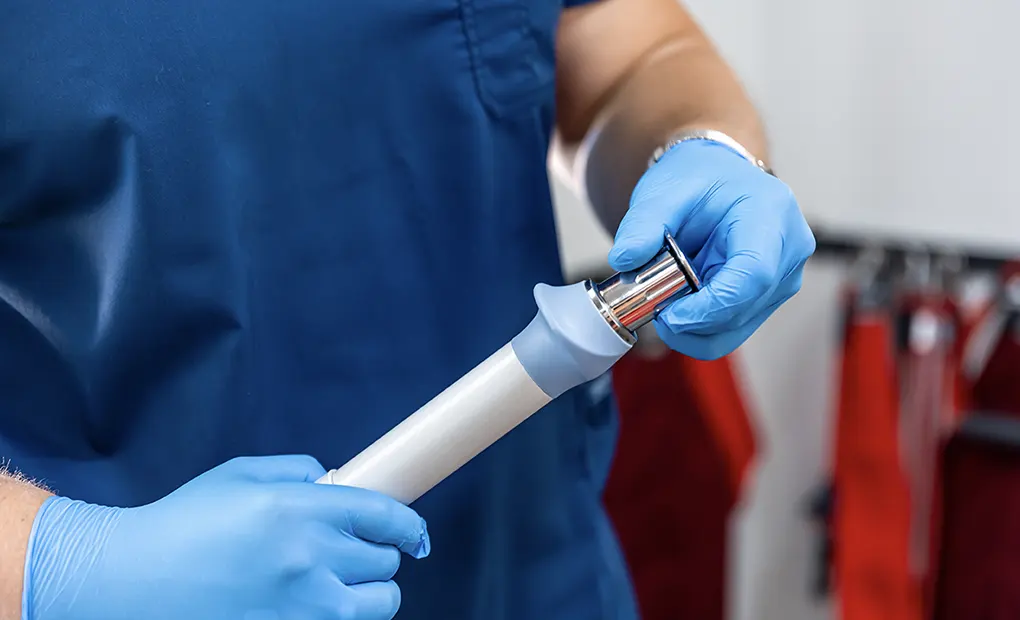 Professional servicing an ultrasound probe for medical use