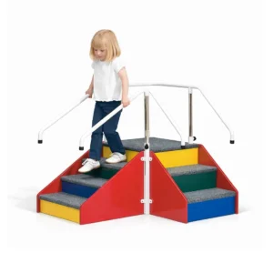 Young Girl walking on colourful childs training corner stairs