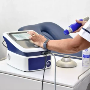 Nurse preparing to use radial shockwave device on trolley